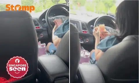 PHV driver uses phone and handles cash while driving, gets 'formal warning' from Tada