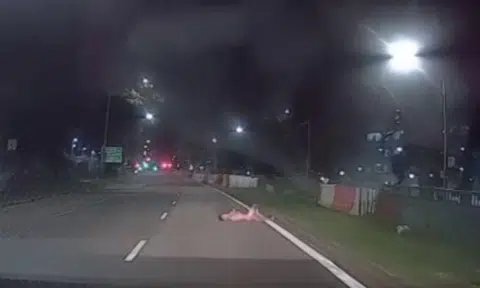 A 34-year-old man has been arrested after a video shows him lying naked on a road in Sembawang.