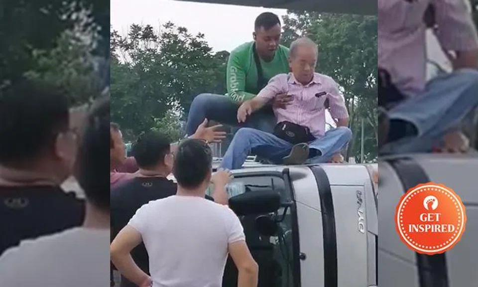 GrabFood rider rescues man from overturned van after breaking its window 'in 1 blow'