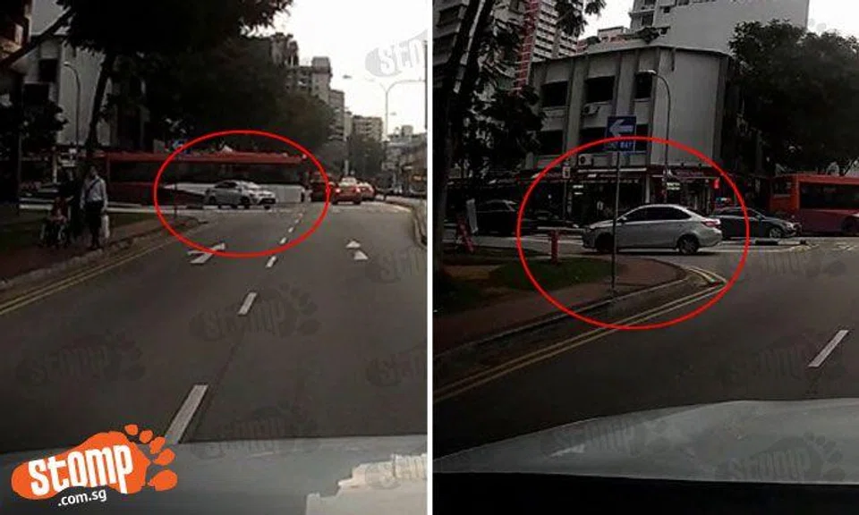 Not only does driver make illegal U-turn, but also goes against traffic
