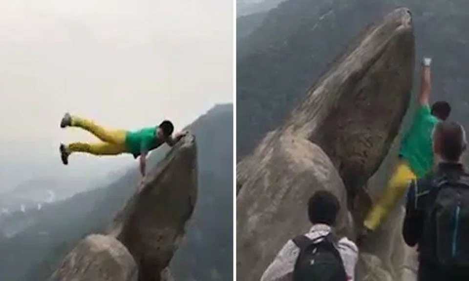 Chinese man falls off cliff side while posing for photos -- and miraculously survives