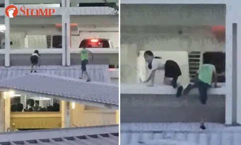 Kids walking on roof of sheltered walkway in Jurong West run away after seeing Stomper film them