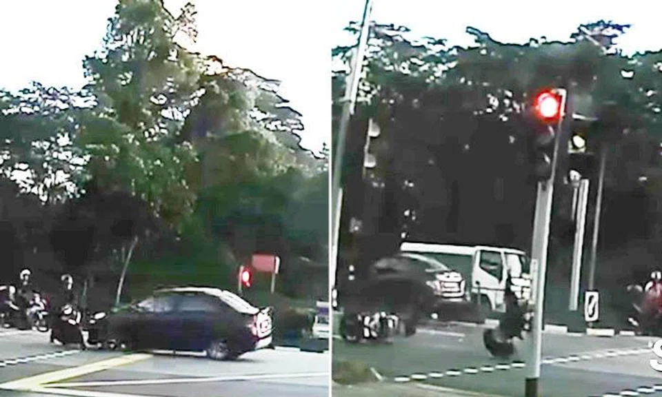 Motorcyclist sent flying after getting hit by car in Yishun