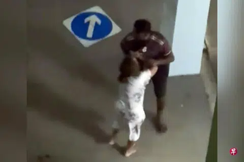 A man and a woman were seen arguing on a street in Woodlands, with the woman so emotional that she was reportedly seen removing a bus stop sign.