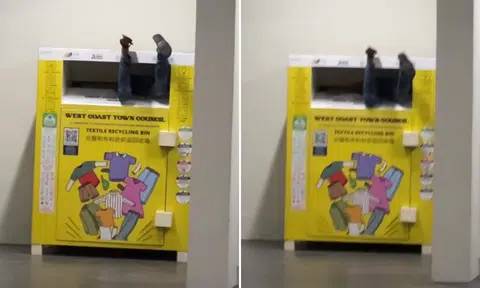 Man’s legs stick out of Jurong West recycling bin