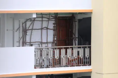 Owner of Commonwealth unit encloses home with puzzling fixture; neighbours report frequent harassments