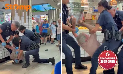 Elderly man struggles with police in coffee shop