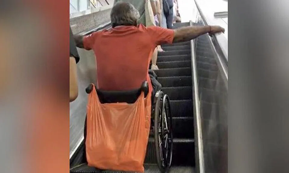 A white-haired man in a wheelchair was seen taking an escalator unaided at Bugis MRT station, his hands gripping the handrails tightly as he kept his wheelchair on the ascending escalator.