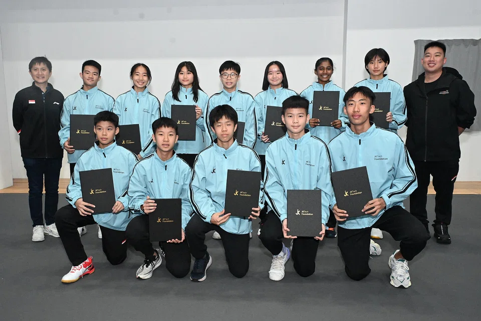 The twelve student-athletes who received the JK Tech scholarship.