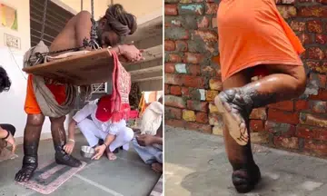 indian man stands for years to meet hindu deity