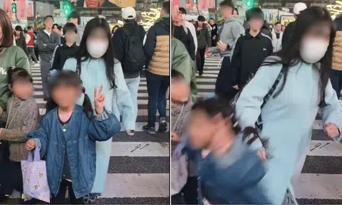 A woman was filmed slamming into a young girl posing for a photo at Tokyo's Shibuya Crossing.