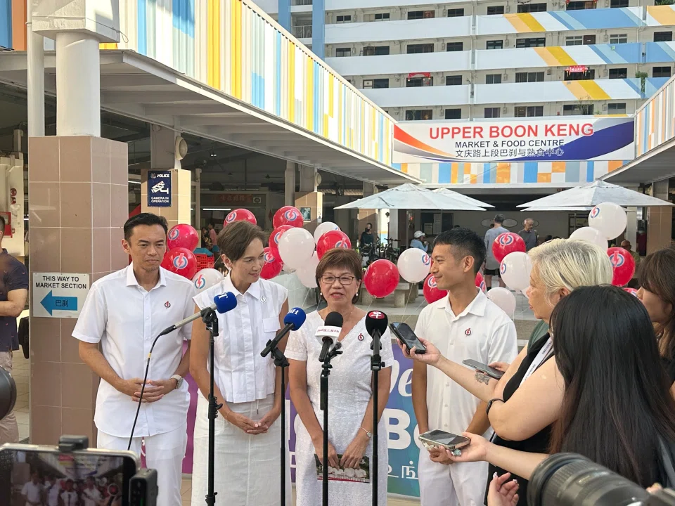 PAP Jalan Besar candidates (from left) Wan Rizal, Josephine Teo, Denise Phua and Shawn Loh during the walkabout at Upper Boon Keng Market on April 27.