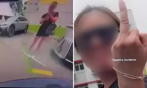 Woman chopes lot in Kovan by standing in it -- then flips middle finger at driver reversing in
