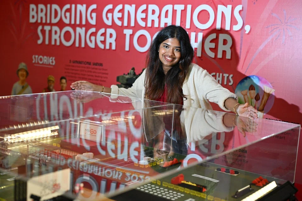 Ms Anne Saphrin Alex Sathyan, 21, who designs some of the drone displays in the drone show, at the South East District booth.