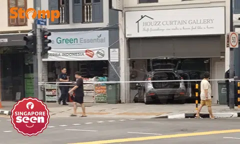 Car crashes into shophouse after collision at Geylang Road, driver assisting with investigations