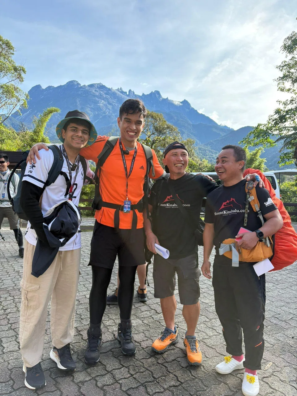 (From left) Mr Prajesh Dhimant Patel and Mr Emyr Uzayr with mountain guides Cornelius Sanan and Billy Sapinggi.