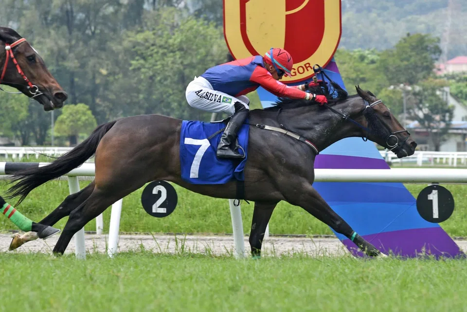 Magic Player (Andre da Silva) gaining the verdict in the Class 5B race (1,150m) at Sungai Besi on July 13, 2024. 