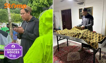 Muslim undertaker performing burial rites