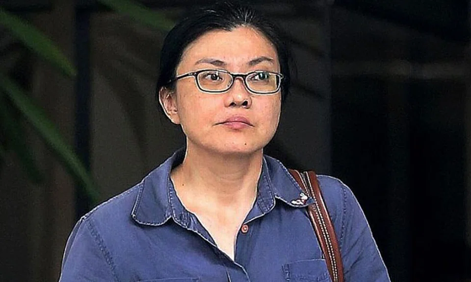 Koh Sock Buay was jailed 14 weeks for dishonestly misappropriating $26,822 and trying to bite a police officer's hand.ST PHOTO: WONG KWAI CHOW