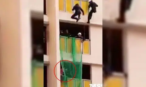 Video: SCDF officers rescue woman sitting on ledge at Redhill Close