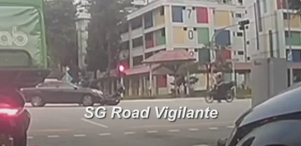 A video of the incident showed a motorcycle travelling along the junction when a dark-coloured car appeared to collide with it. 