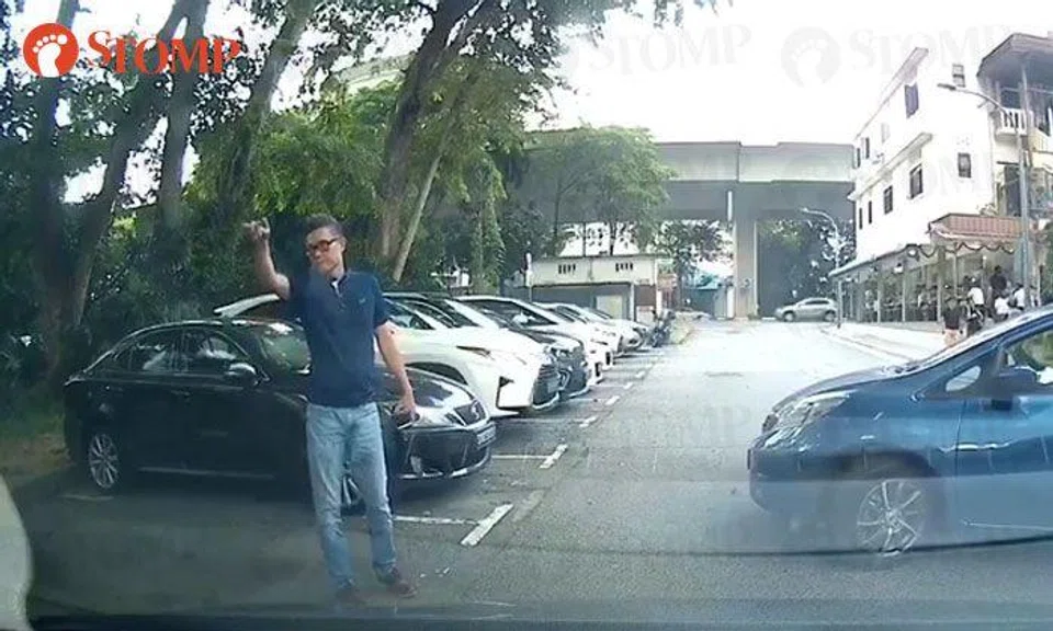 Guy stands in Pepys Road lot to 'chope' it for friend even though another driver is waiting