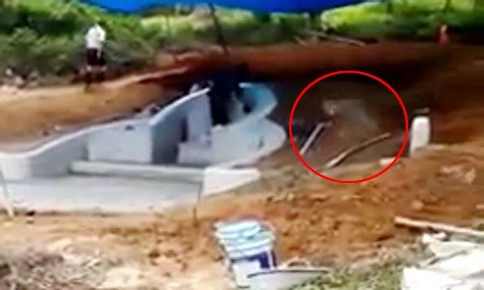 Chilling video shows 'ghostly' figure creeping into grave