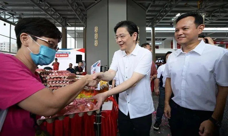 PM Lawrence Wong with MP Mr. SMS Zaqy Mohamad at the launch of Marsiling-Yew Tee GRC's MY $1 Deals at 888 Plaza on Jan 18.