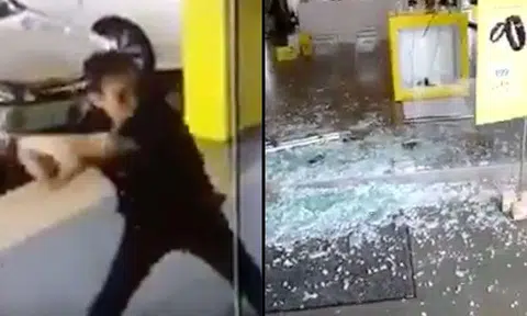 Disgruntled Malaysian man shatters glass panels at telco service center with golf club in Sibu