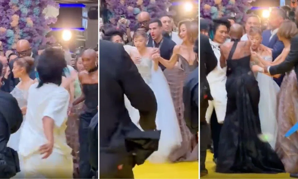 Grande appeared horrified as the man ran at her and grabbed her shoulders.