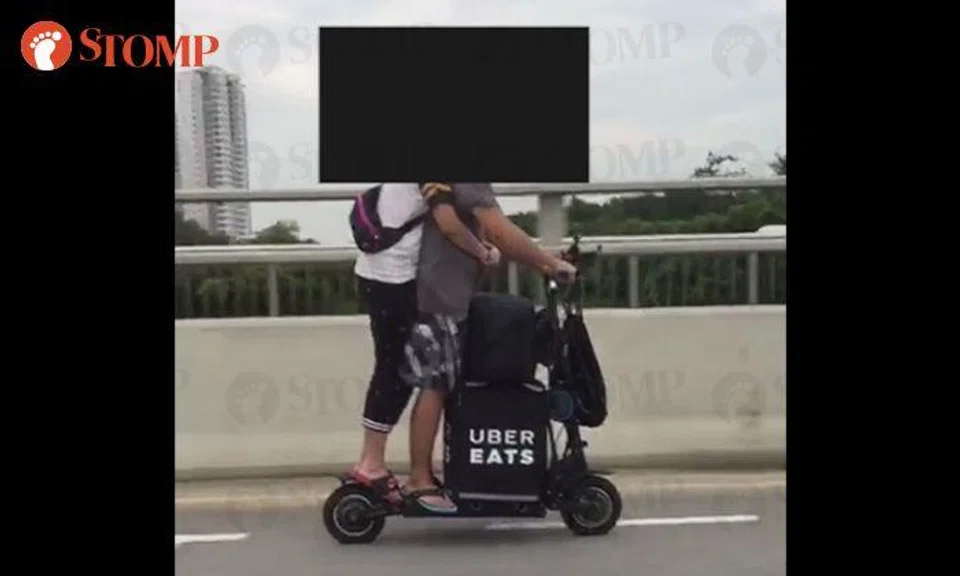 UberEATS delivery couple riding e-scooter at Bedok South is an accident waiting to happen