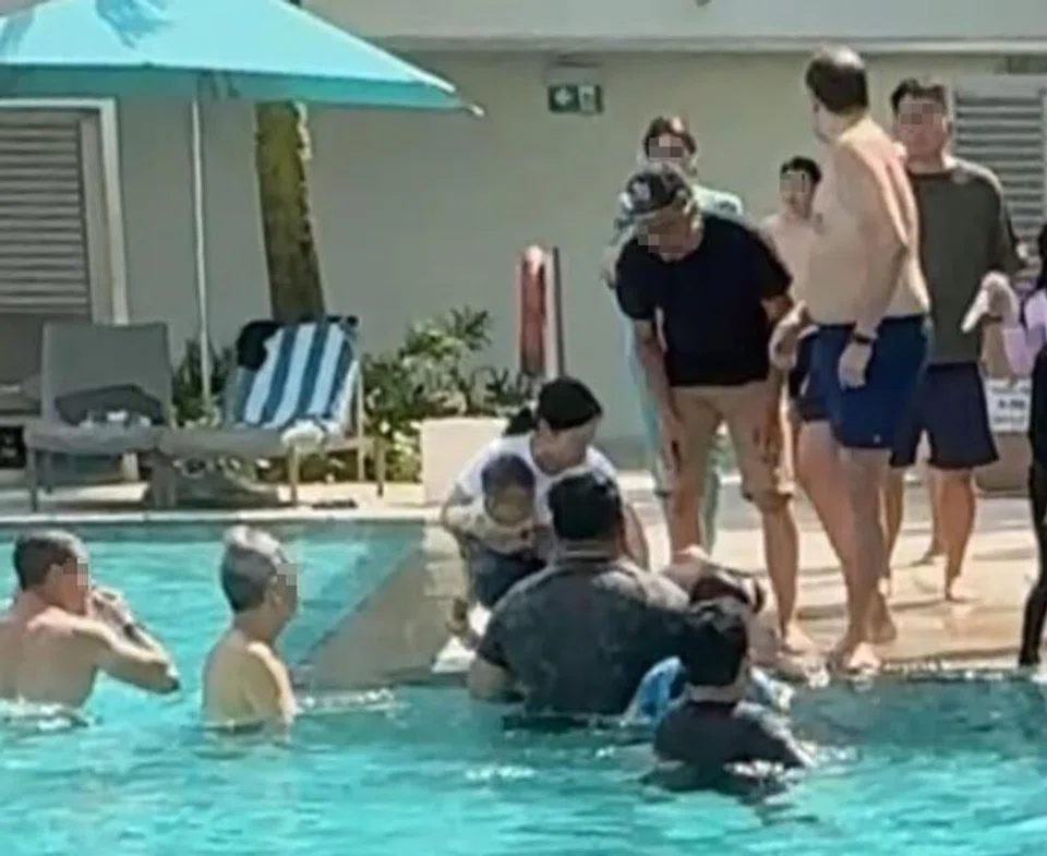 A hotel guest identified the quick-thinking bystander as a male tourist in a black shirt and a baseball cap.