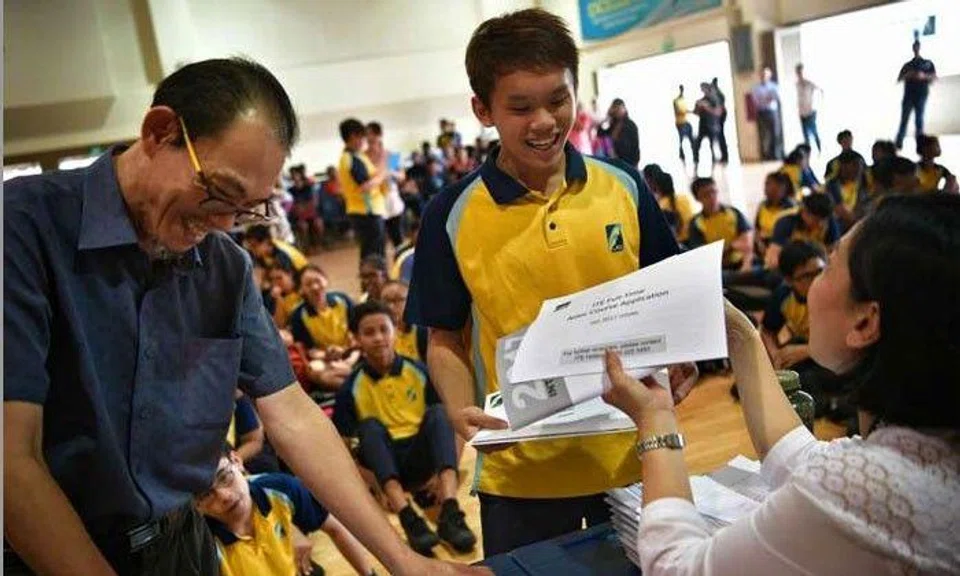 Crest Secondary student Ryan Ang collecting his N-level results on Dec 19, 2016.ST Photo by The Straits Times (Mark Cheong)