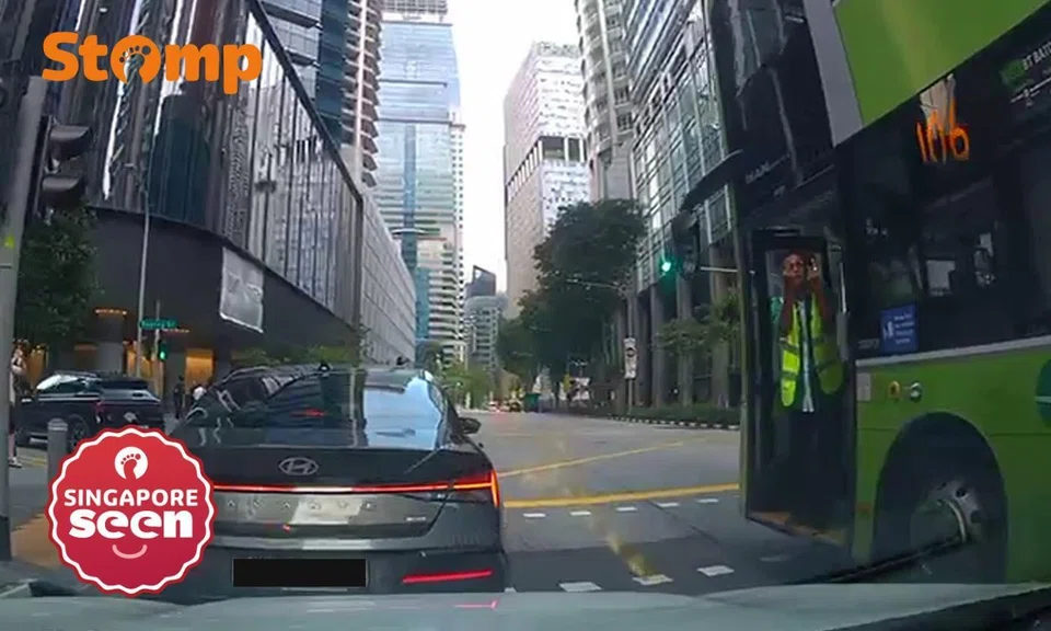 bus captain points middle finger