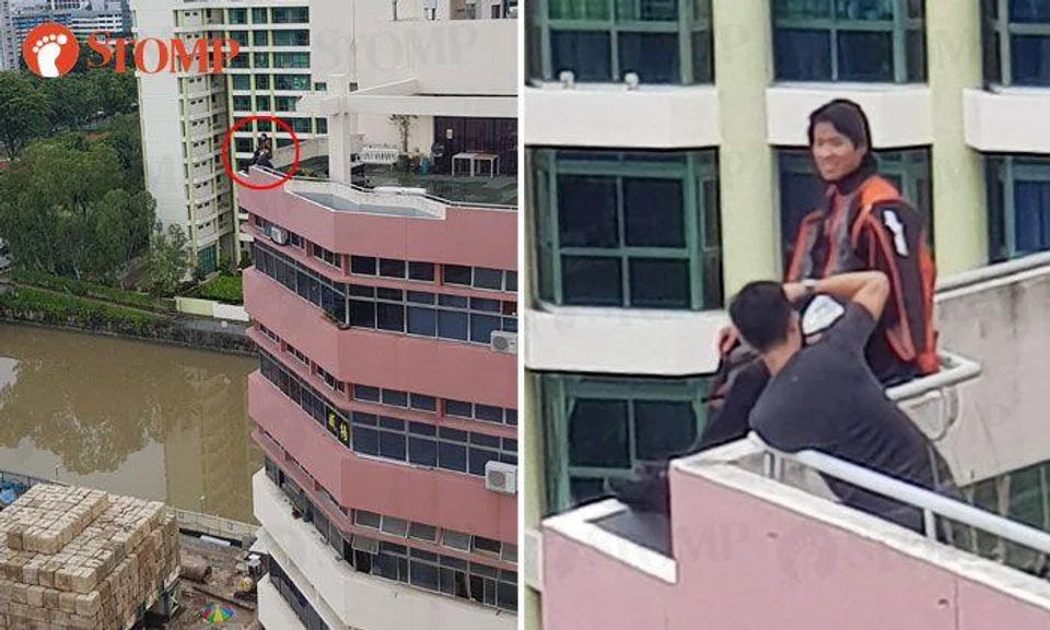 Duo go to great heights to take photo on roof of building at 21 Moonstone Lane