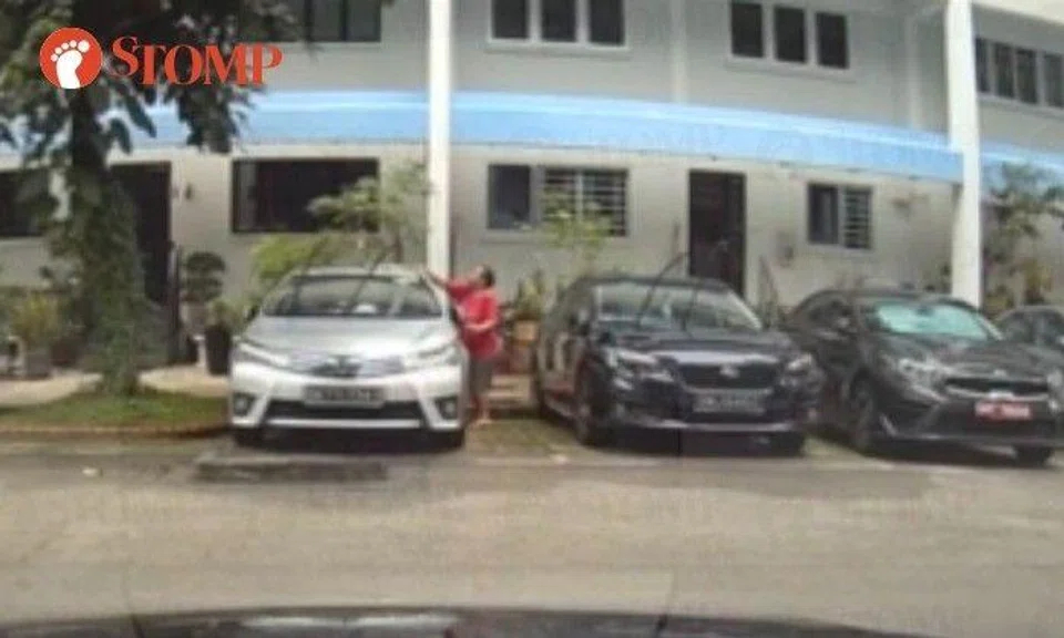 Domestic helper seen washing 2 cars at Serangoon North carpark has 'no well-being issues': MOM