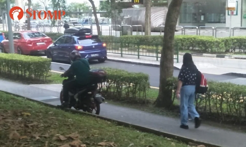 A motorcyclist was seen on the pavement where pedestrians were walking near Block 180 Lompang Road in Bukit Panjang on Sept 30.