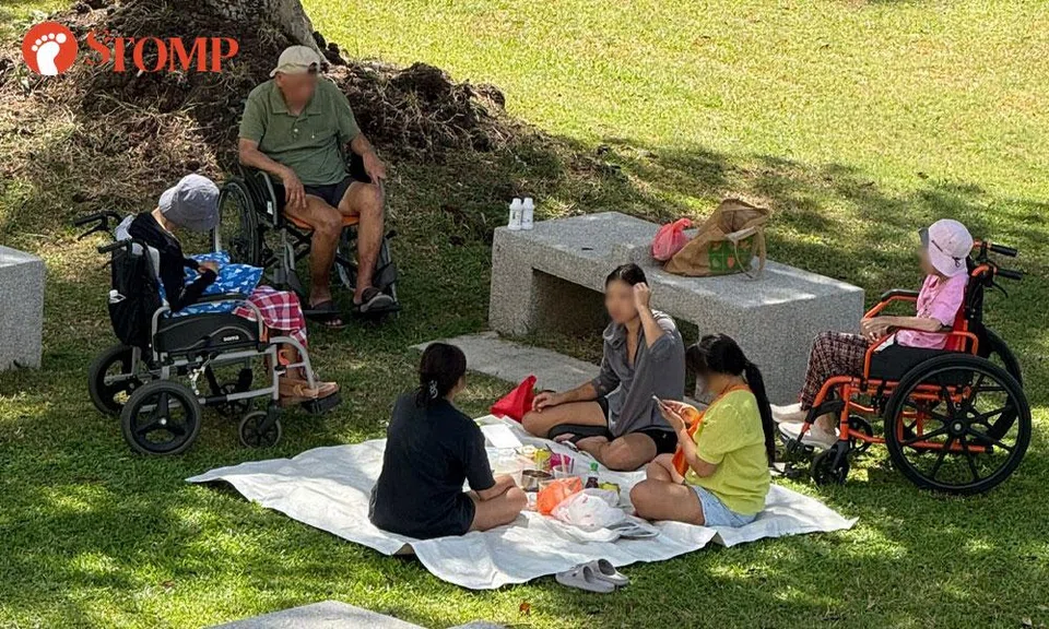 helpers ignore elderly during picnic at marine drive