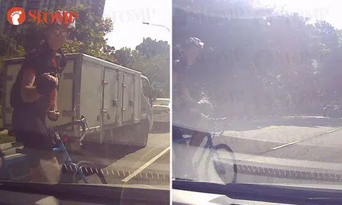 Cyclist makes rude gestures and splashes water at driver after getting honked at
