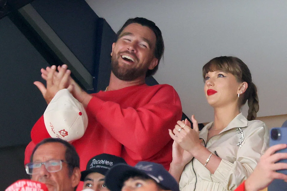 Football star Travis Kelce says he and pop superstar Taylor Swift are "just two people who are in love". 