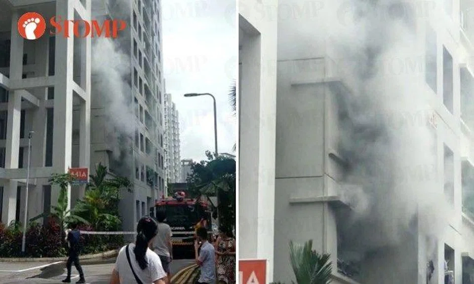 Stomper Hana share a video showing smoke billowing out of a second-storey window of the block as people gathered below. A fire engine can also be seen.