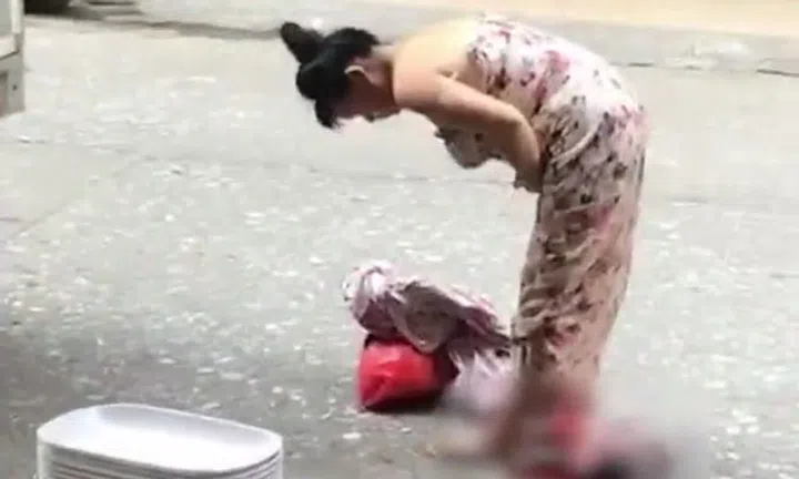 Chinese woman gives birth to baby while standing on street -- then ...