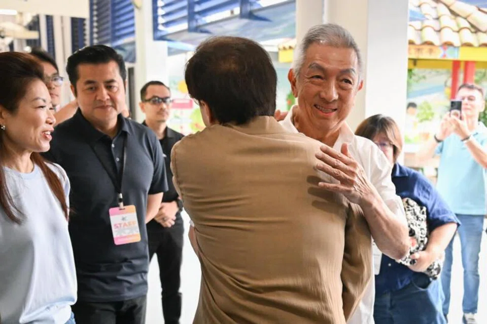 Jackie Chan with Singaporean businessman and philanthropist Peter Lim at Pei Chun Public School in Toa Payoh on July 7.