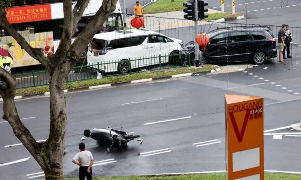 Photographs of the scene in Chinese-language newspaper Shin Min Daily News show two multi-purpose vehicles with damaged bonnets. A motorcycle is seen lying on its side on another part of the road, with some of its parts strewn about.