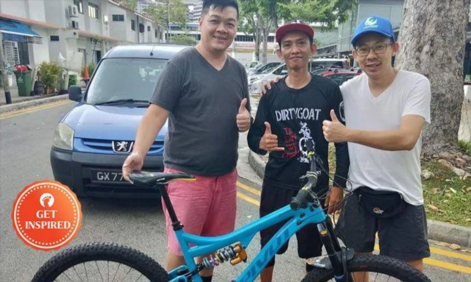 (From left) Calvin, the man who found his bike and Calvin's friend.