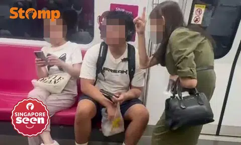 Woman warns commuter about MRT fine for eating on train