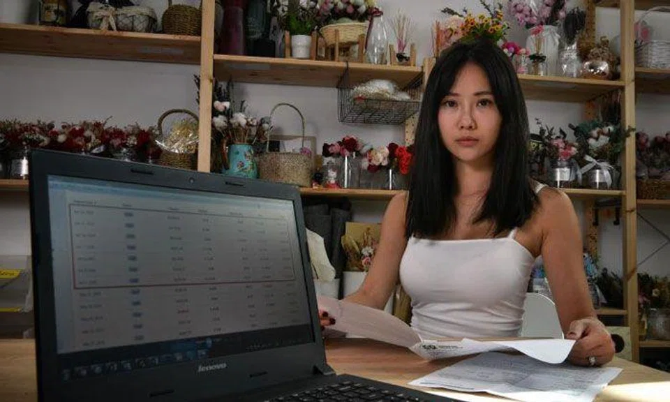 Ms Wendy Han, co-founder of online flower shop Floristique, said she discovered on Wednesday that hackers had entered its Shopify account and changed the shop's bank account details to their own. As a result, the sales proceeds went directly to the hackers' account instead. ST PHOTO: CHONG JUN LIANG