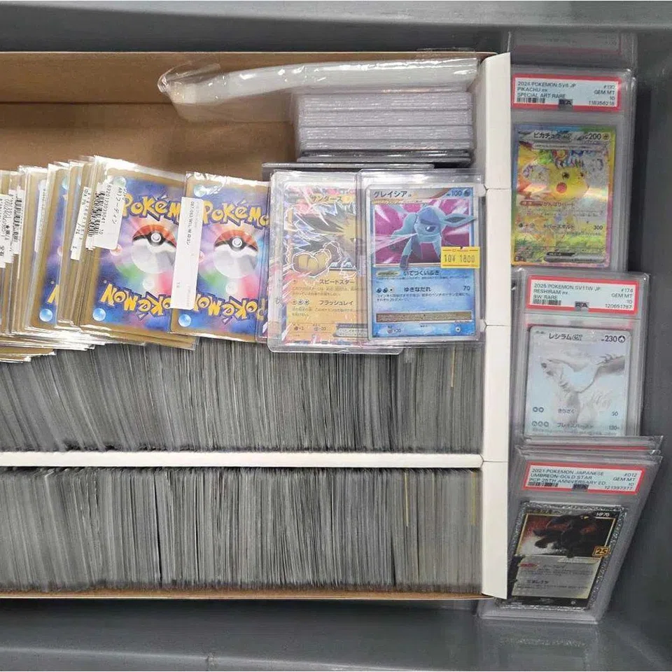 Pokemon trading cards worth more than $30,000 in total were found in the man’s luggage. PHOTO: IMMIGRATIONS AND CHECKPOINTS AUTHORITY/FACEBOOK