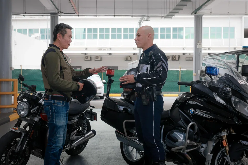 ST senior correspondent Zaihan Mohamed Yusof (left) with Senior Staff Sergeant Ihsan Helmi, a patrol leader in the Traffic Police’s Special Operations Team.