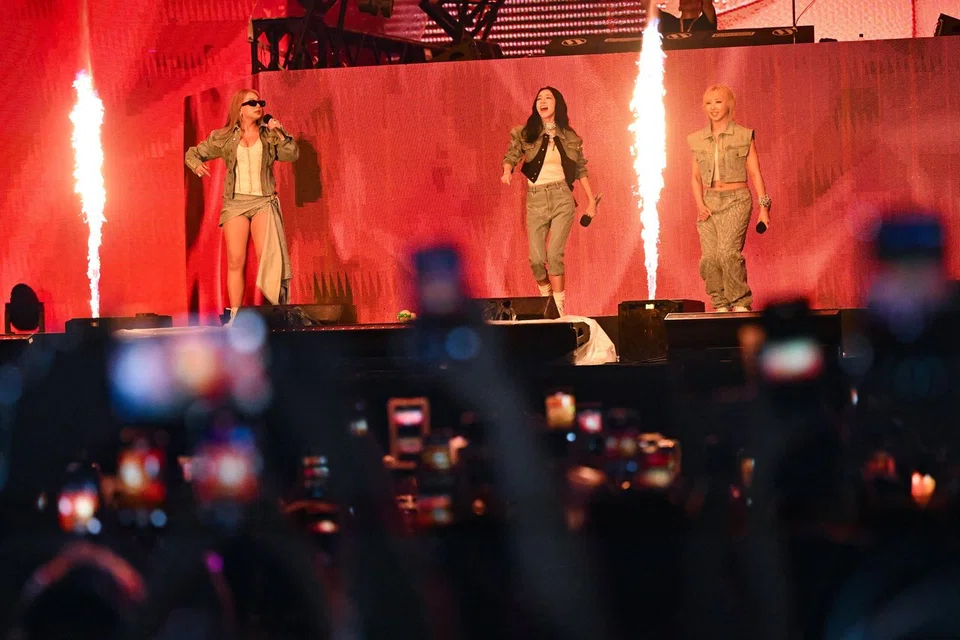 Dara (centre) and her fellow 2NE1 group members CL (left) and Minzy performing at Waterbomb Singapore 2025 on Aug 31.